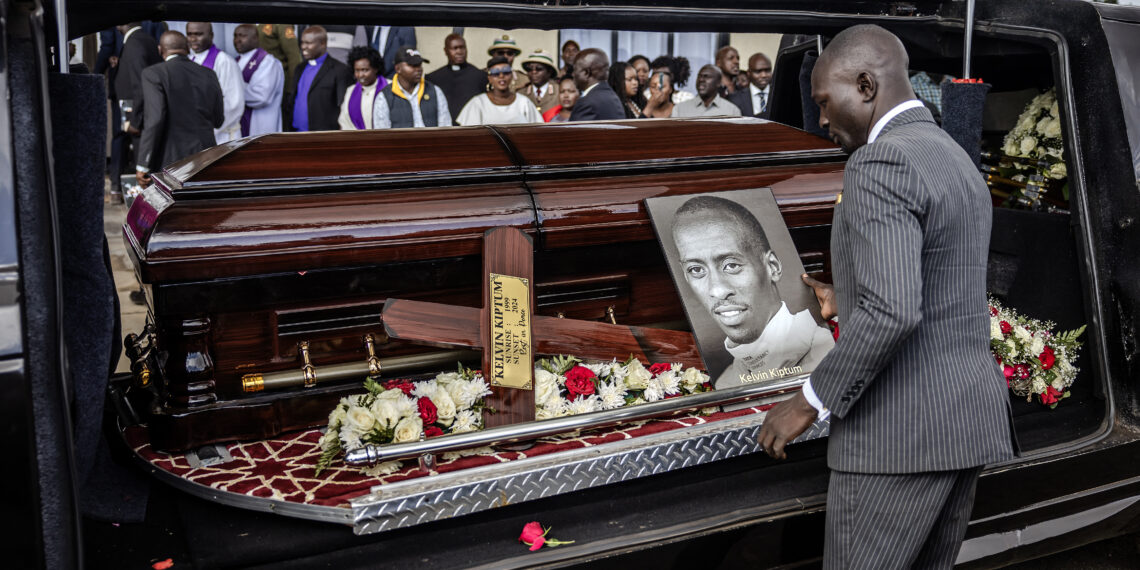 President of the International Athletics Federation Sebastian Coe (2nd R) looks on while attending the funeral proceedings of the late marathon runner Kelvin Kiptum in Chepkorio on February 23, 2024.