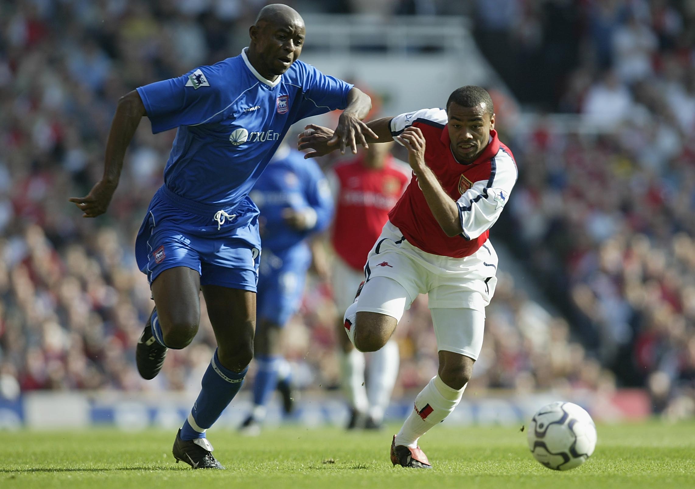  Finidi George of Ipswich Town tries to tackle Ashley Cole of Arsenal during the FA Barclaycard Premiership match between Arsenal and Ipswich Town at Highbury, London. 