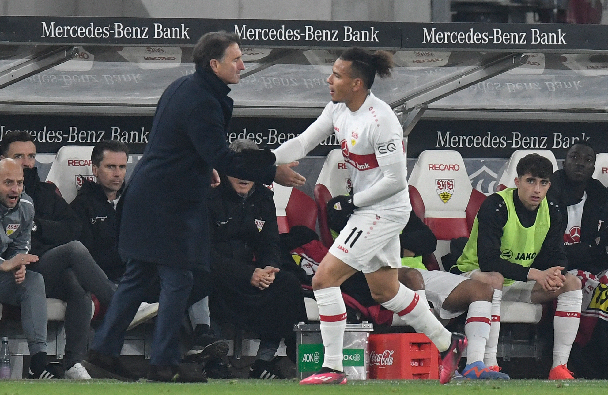 Stuttgart's Colombian forward Juan Jose Perea celebrates scoring the 1-2 goal with his coach Bruno Labbadia during the German first division Bundesliga football match between VfB Stuttgart and FC Bayern Munich in Stuttgart, southwestern Germany on March 4, 2023. 