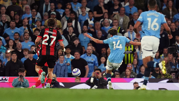 Man City edge Bournemouth to boost UCL hopes as De Bruyne bids Etihad farewell